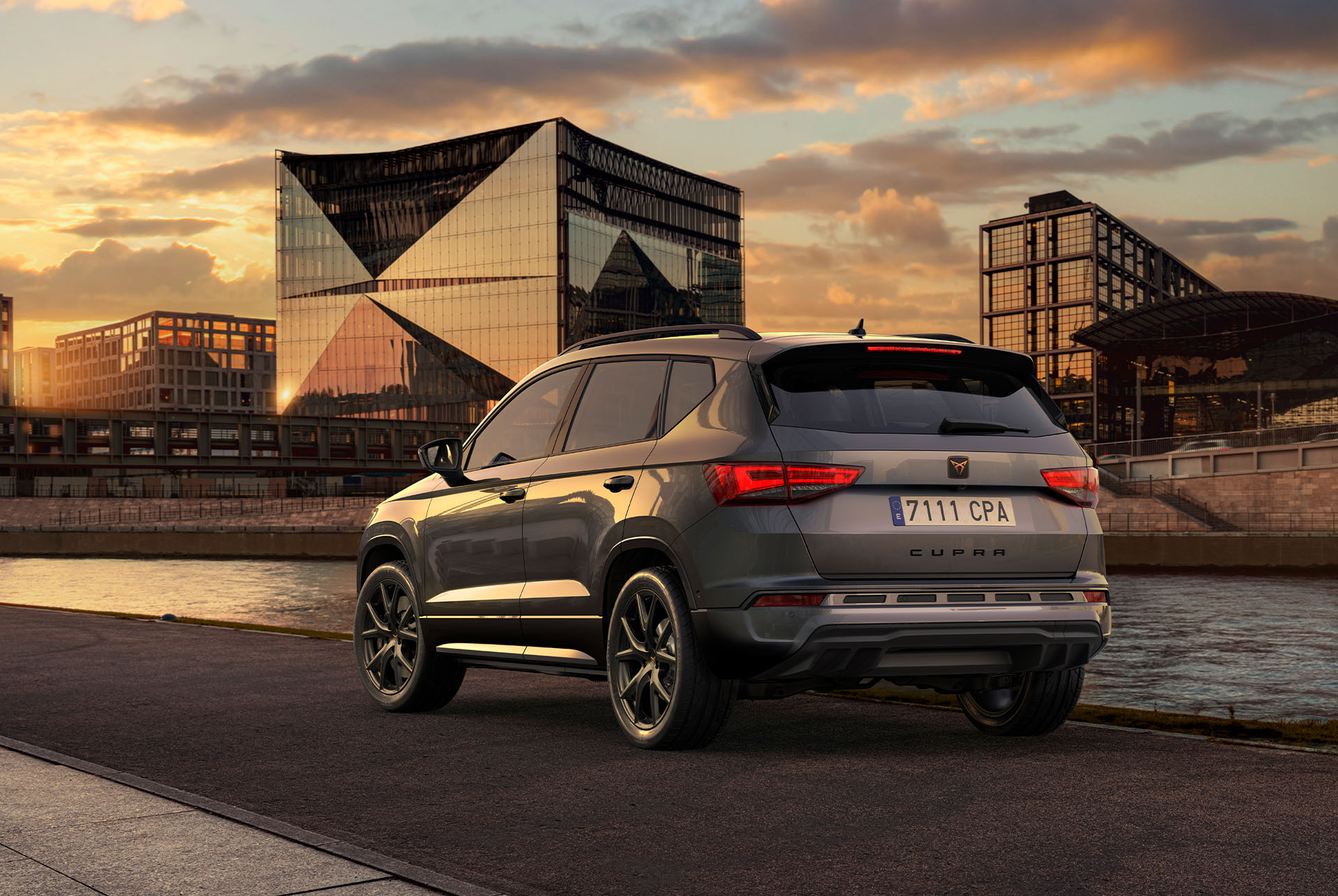Rear view of the CUPRA Ateca SUV at sunset, highlighting the new lower front grille with air caps and the new rear diffuser, both designed to reinforce the exterior design and taking care of the aerodynamics.