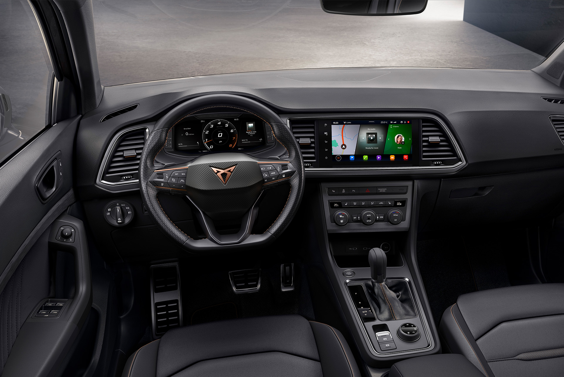 Interior view of the CUPRA Ateca SUV, showcasing the steering wheel with satellite buttons for engine start and drive profile selection. Paddle shifters behind the wheel offer convenient gear shifting. 