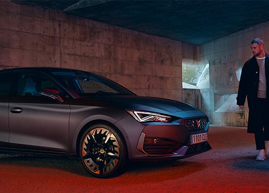 new CUPRA Leon ehybrid magnetic tech matte compact sports car front view charging 