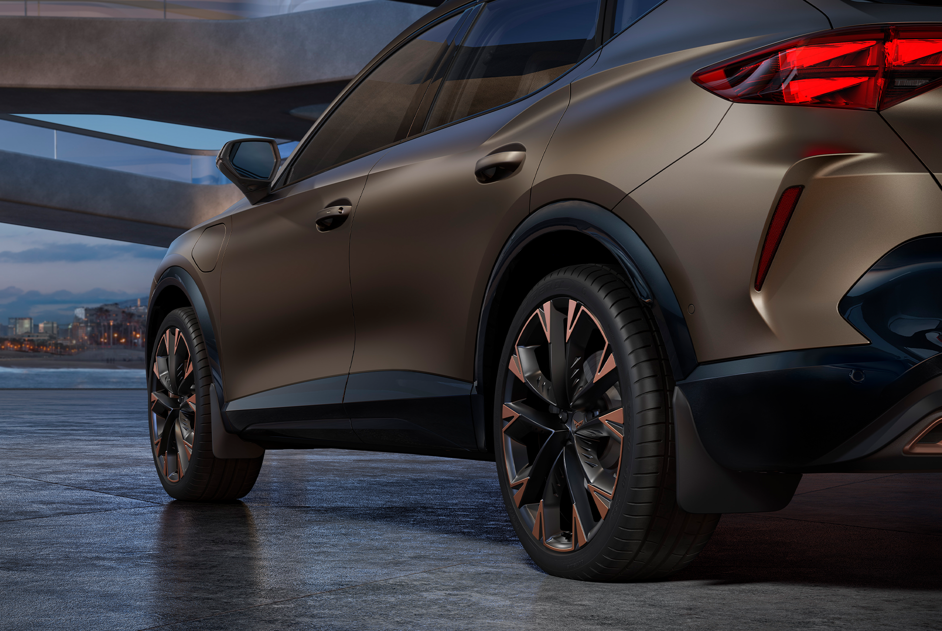 cupra formentor rear view close-up that emphasizes the alloy wheel design and, especially, the front and rear mudflaps—built to keep dirt off your vehicle.