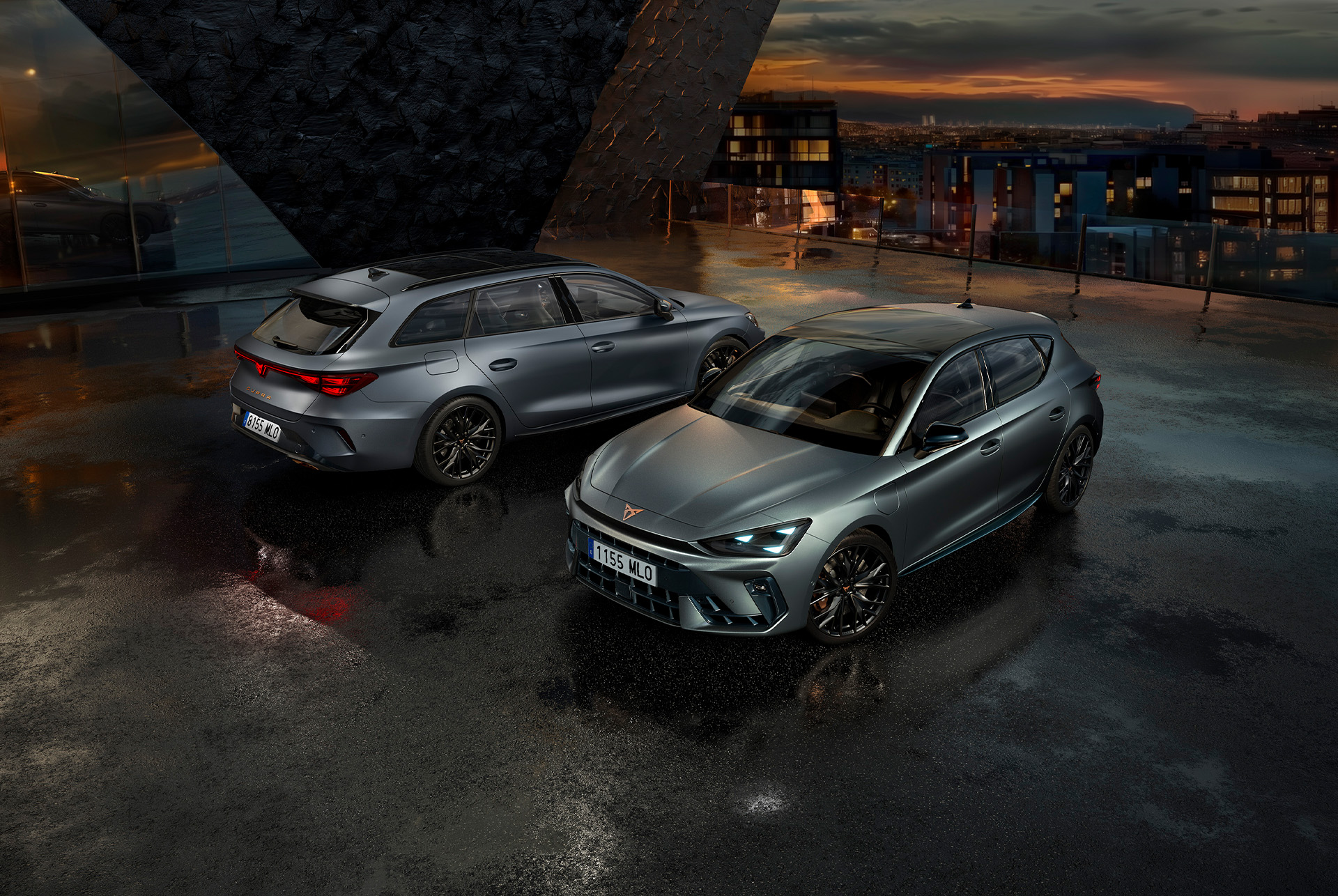 shot of two cupra leon parked in a night setting; one showing the front design and the other, the rear design. Both in dark shades.