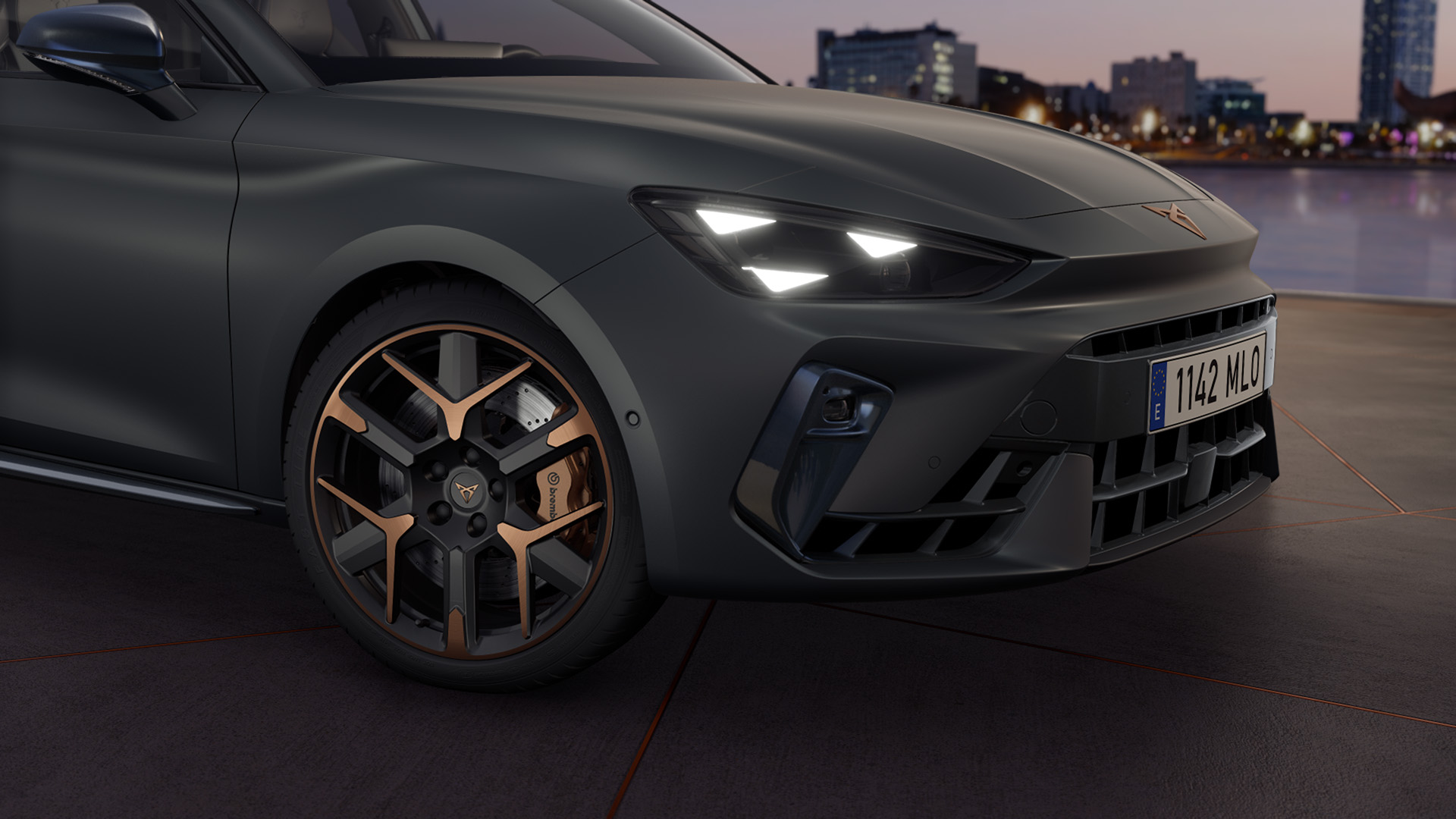 close up of cupra leon hailstorm copper accent and black forged wheels with a triangle eye headlight
