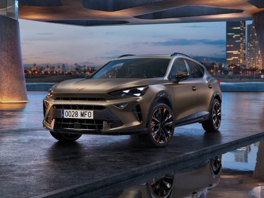 new cupra formentor offer, suv in century bronze matt, model year 2025, with 19 inch artic copper wheels and cityscape background. New car offers available.